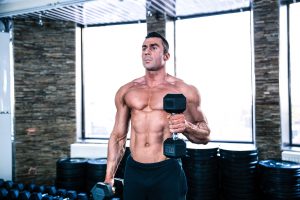 Bodybuilder doing Bicep curl Drop Set