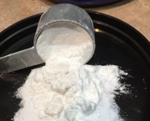 Scoop of Leucine Powder